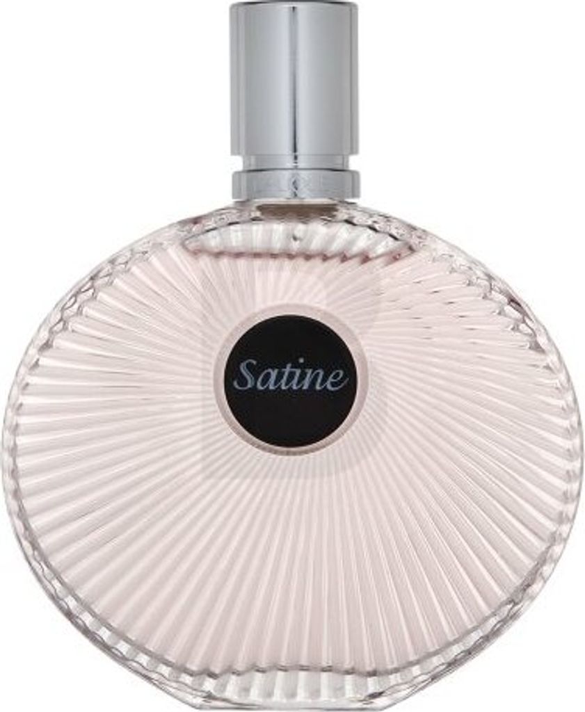 A perfume bottle with a silver cap and a round black label with the word "Satine" written on it.