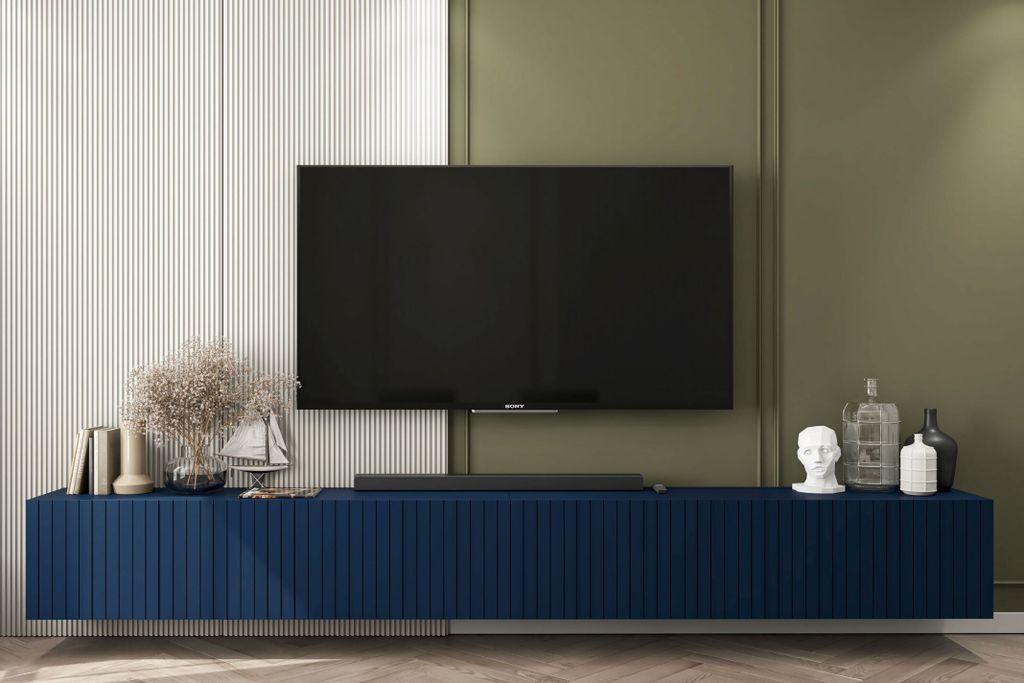 A modern living room with a TV stand and television.