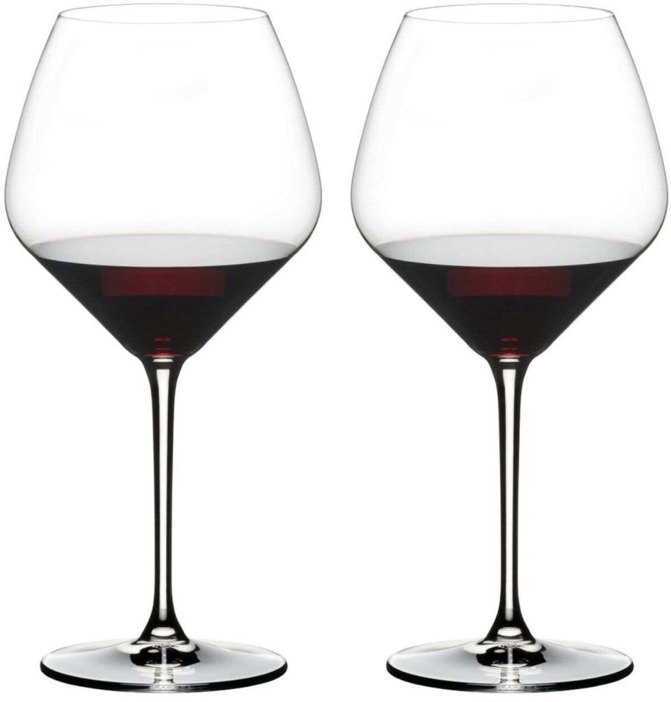 Two wine glasses filled with red wine, presented against a white background.