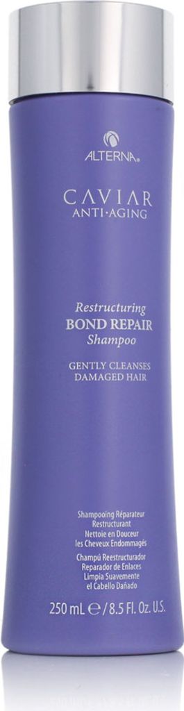 A studio shot of a purple shampoo bottle with a silver cap.