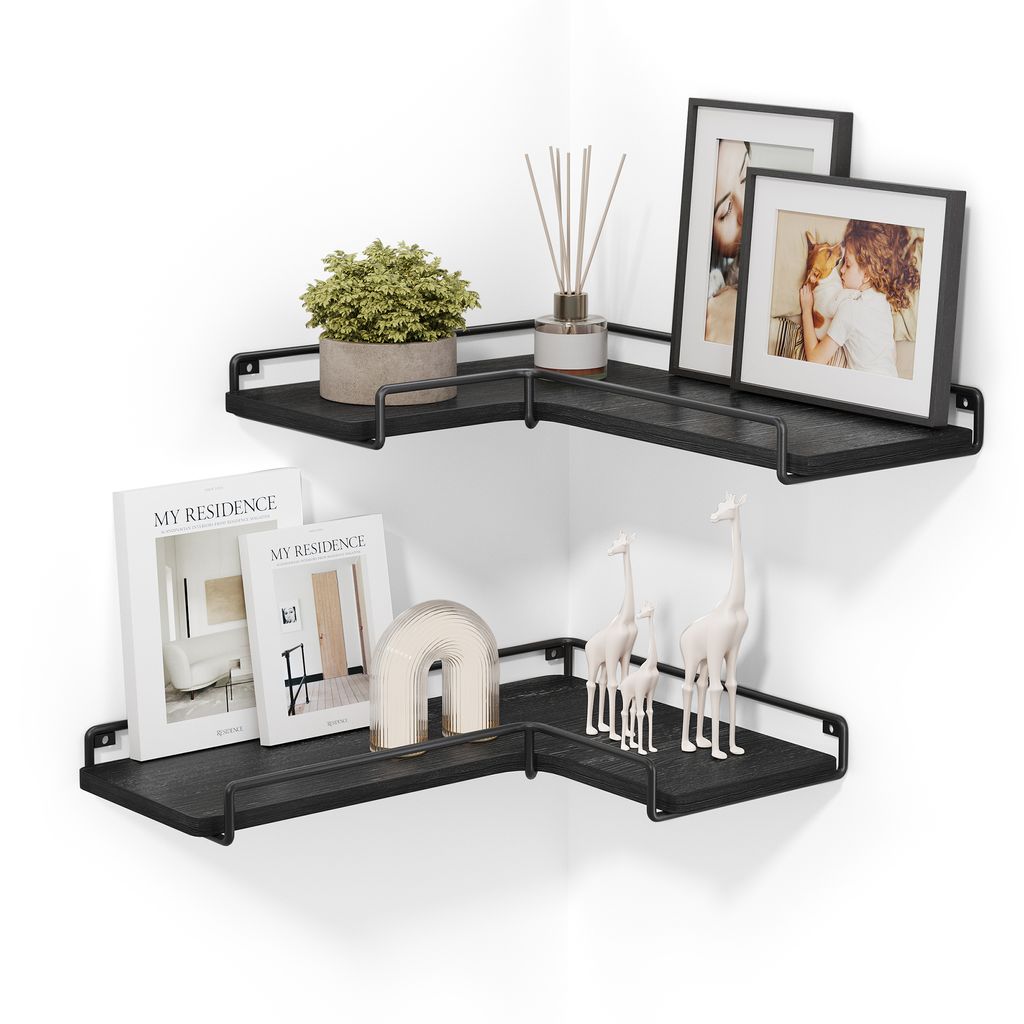 A set of two black L-shaped corner shelves mounted on a white wall, decorated with various items.