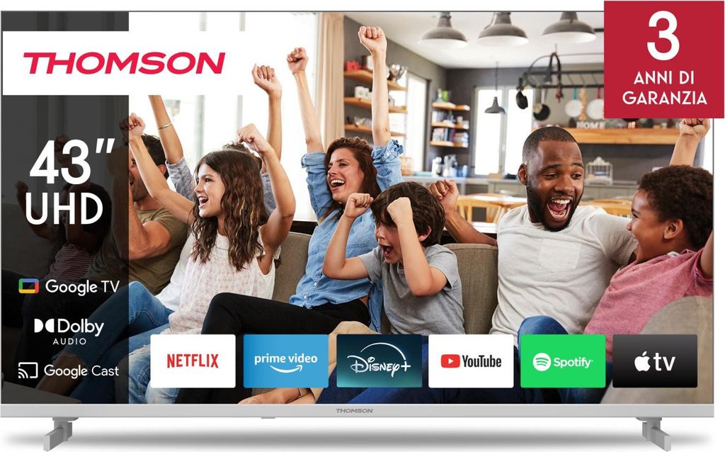 A family is celebrating while watching a TV, with app logos displayed on the screen.