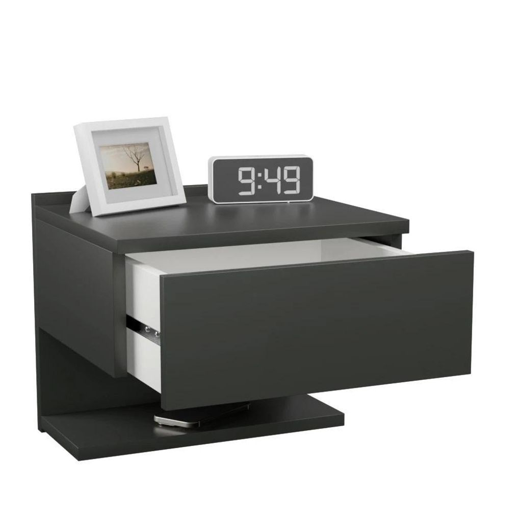 A modern, dark gray floating nightstand with an open drawer, a digital clock, and a framed picture on top.