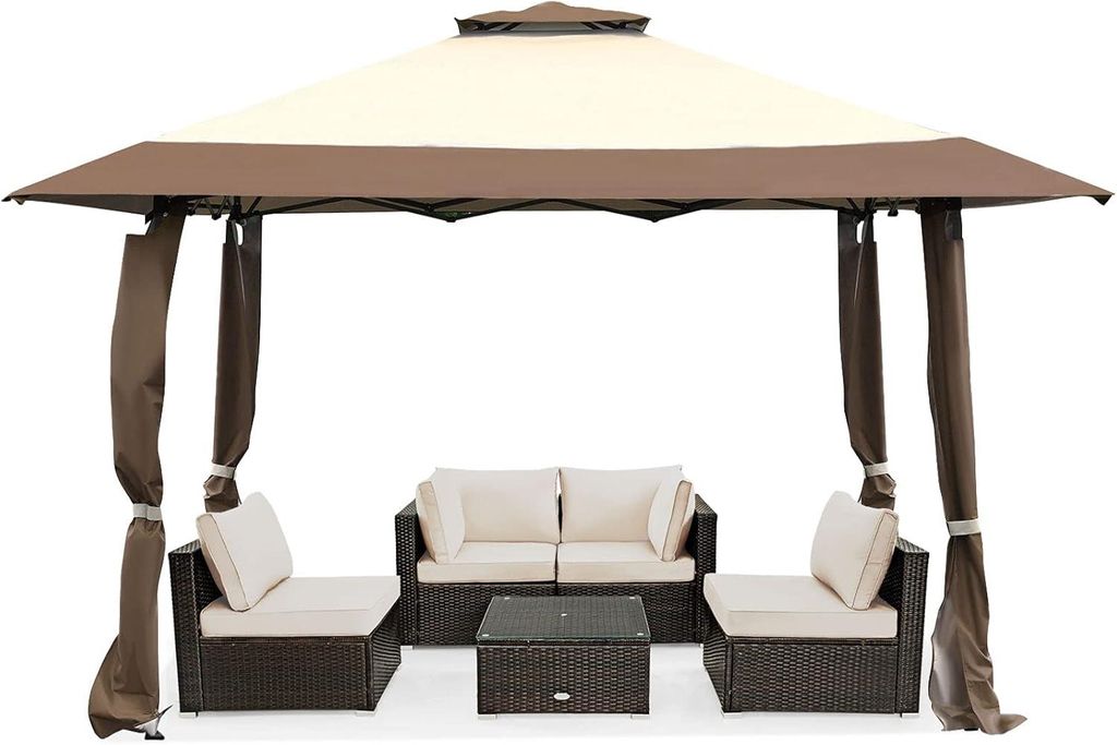 An outdoor gazebo with furniture set up underneath.