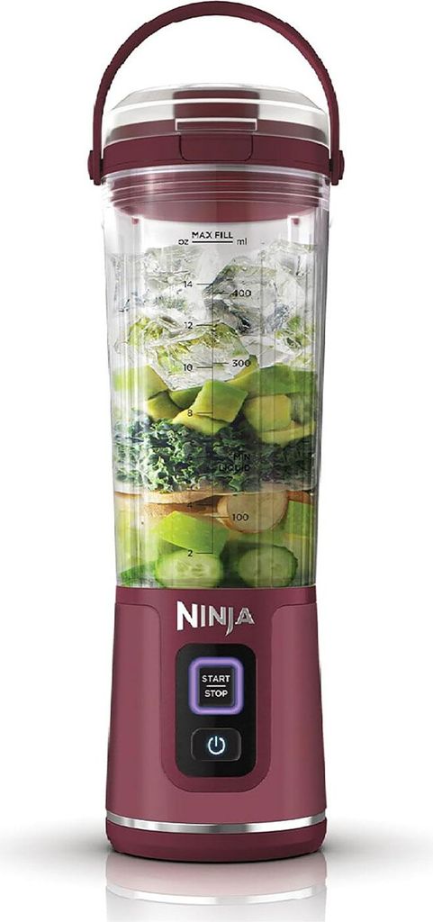 A Ninja personal blender filled with ingredients and ice, shown against a white background.