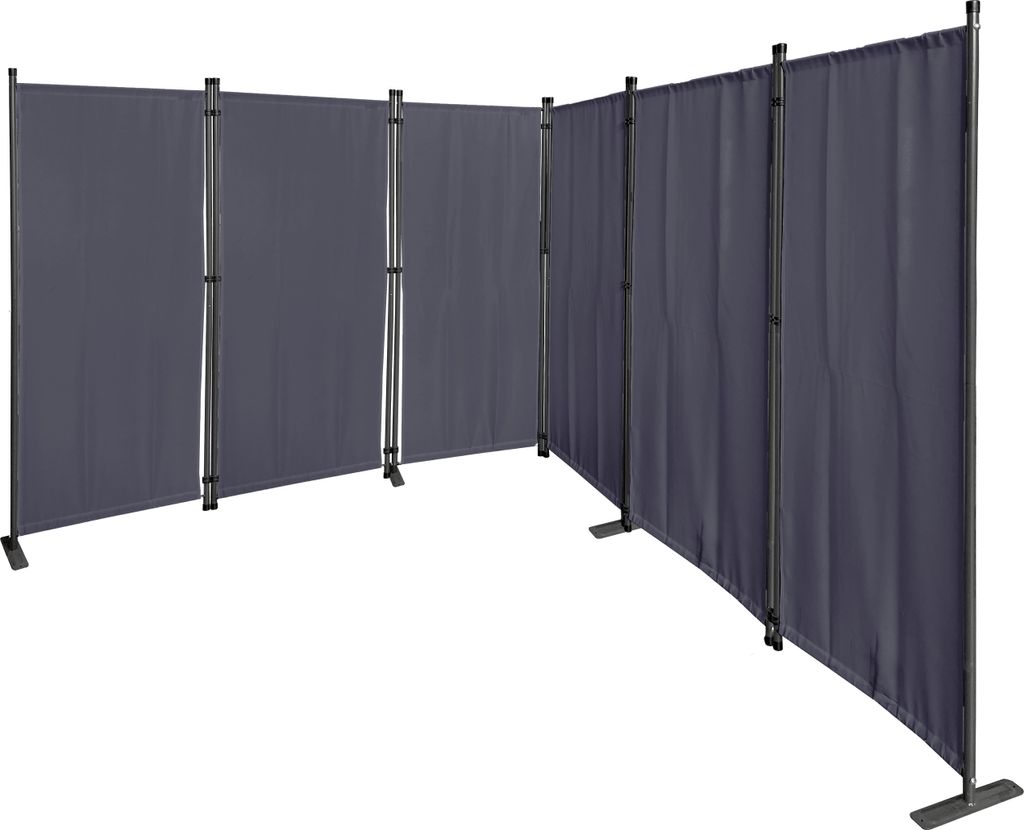 A gray, multi-panel room divider set up in a studio setting against a white background.