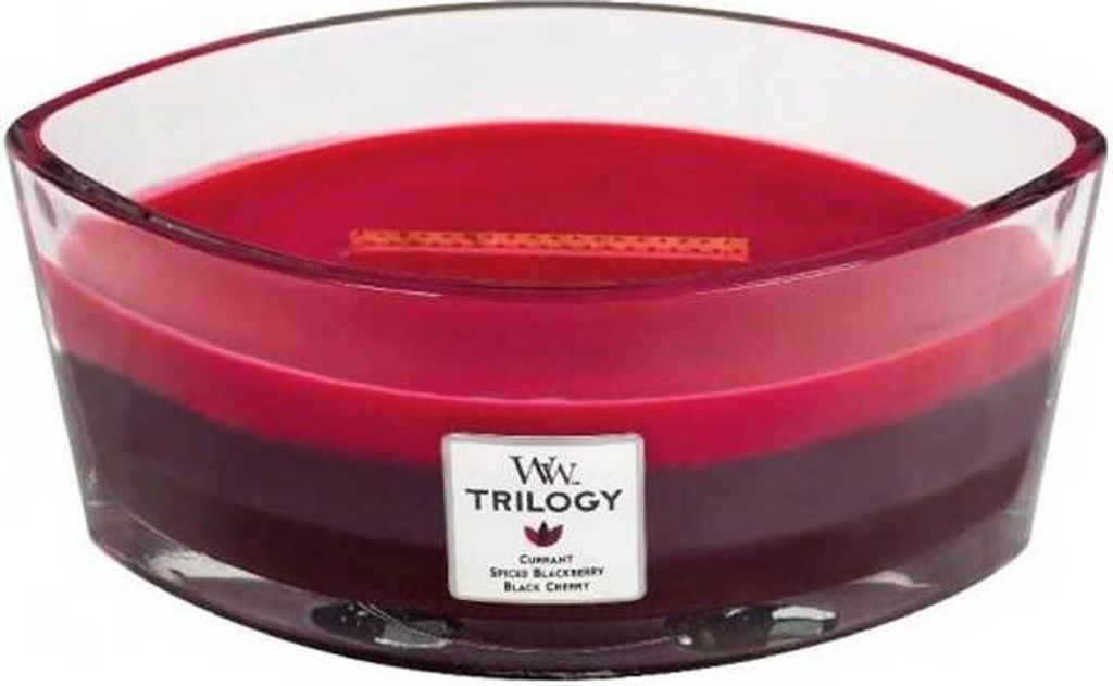 A three-layered scented candle in a glass container.