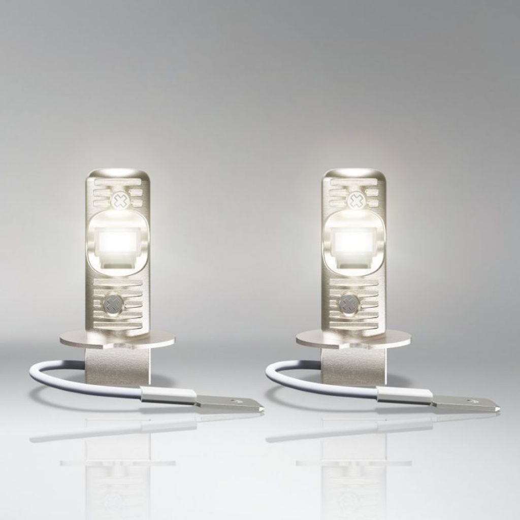 Two LED bulbs are displayed against a gradient background.