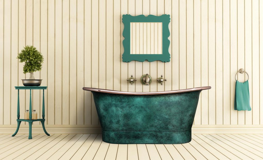 A vintage-style bathroom with a copper-colored bathtub.