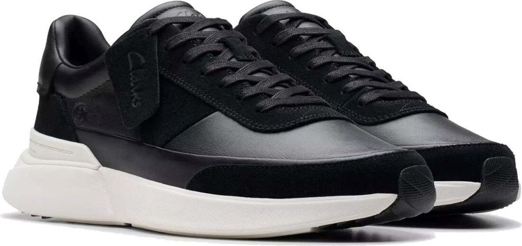 A pair of black Clarks sneakers with white soles, shown from a slightly elevated side angle against a white background.