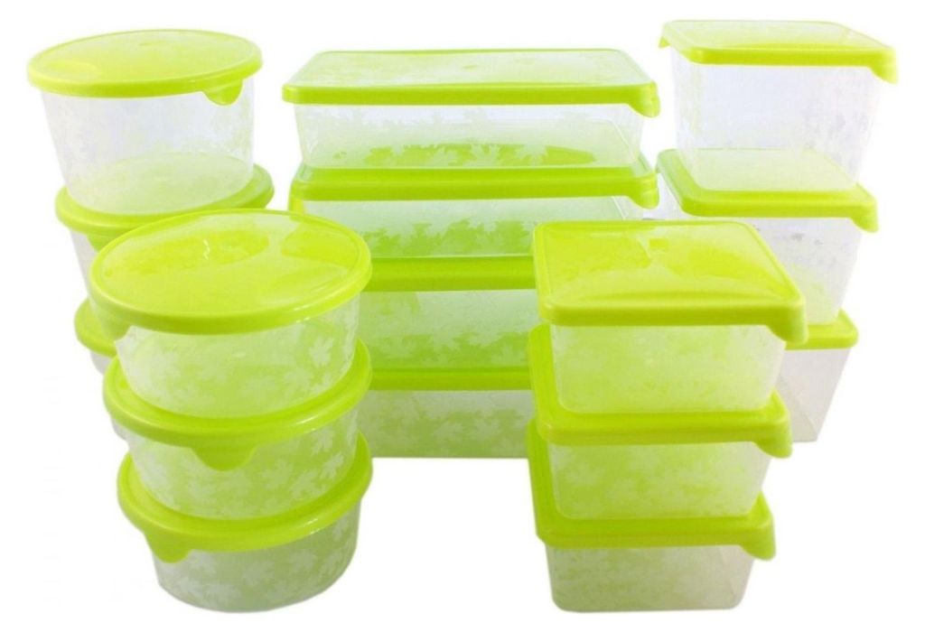 A collection of clear plastic food storage containers with bright green lids, stacked and arranged against a white background.