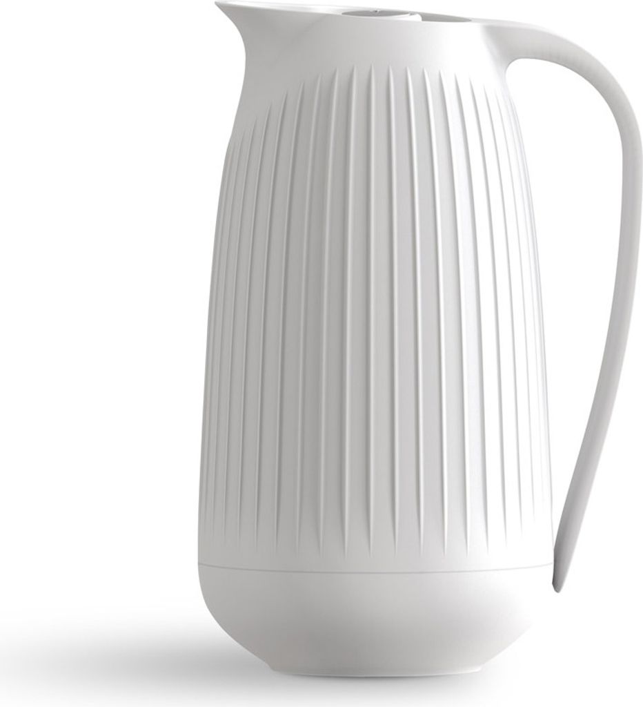 A white pitcher with vertical ridges on a white background.