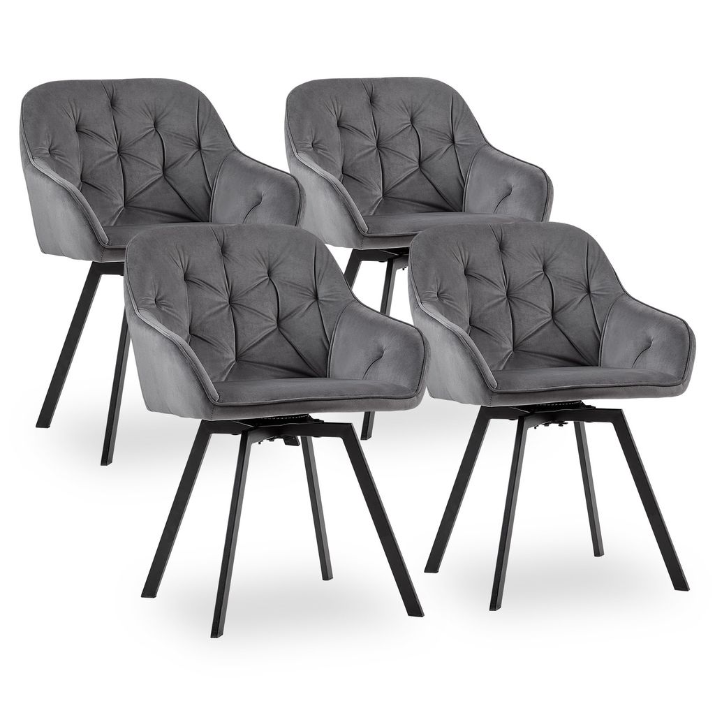 Four gray velvet dining chairs with black legs are arranged on a white background.