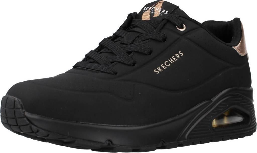 A single black Skechers sneaker with rose gold accents.
