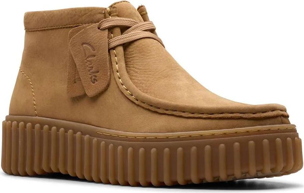 A single brown Clarks clog boot with a thick sole is shown against a white background.