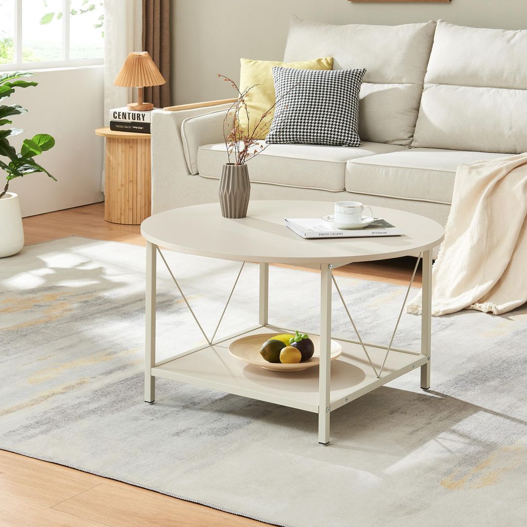 A living room scene with a couch, coffee table, and rug.
