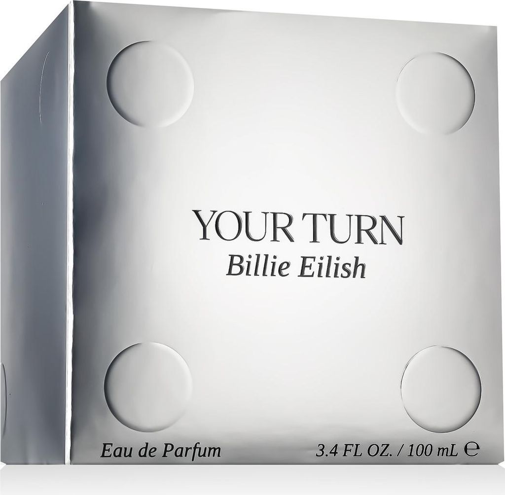 A silver box for a perfume product, designed to resemble a die with circular indentations.