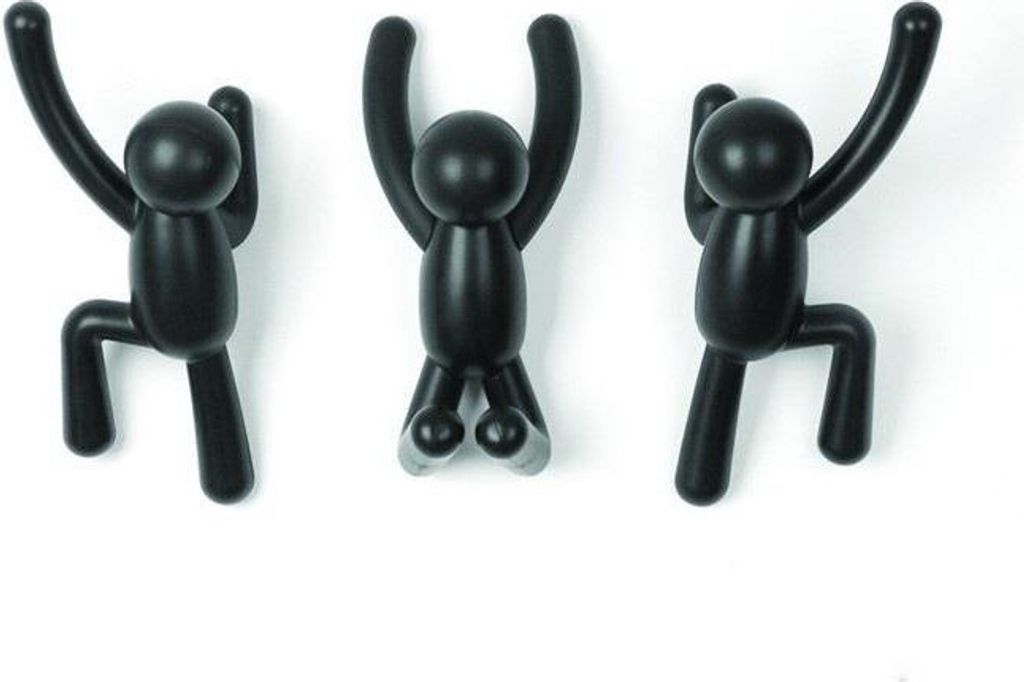 Three black wall hooks shaped like stick figures climbing a wall.