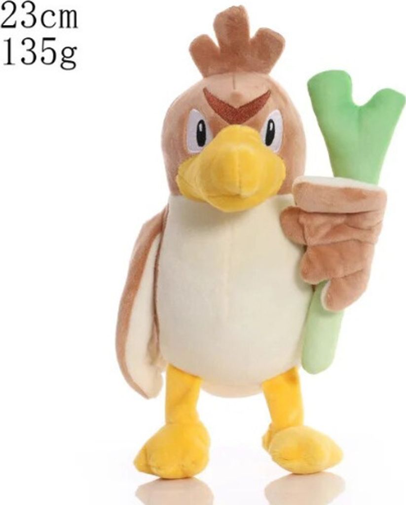 A stuffed toy of a bird-like creature holding a green object.