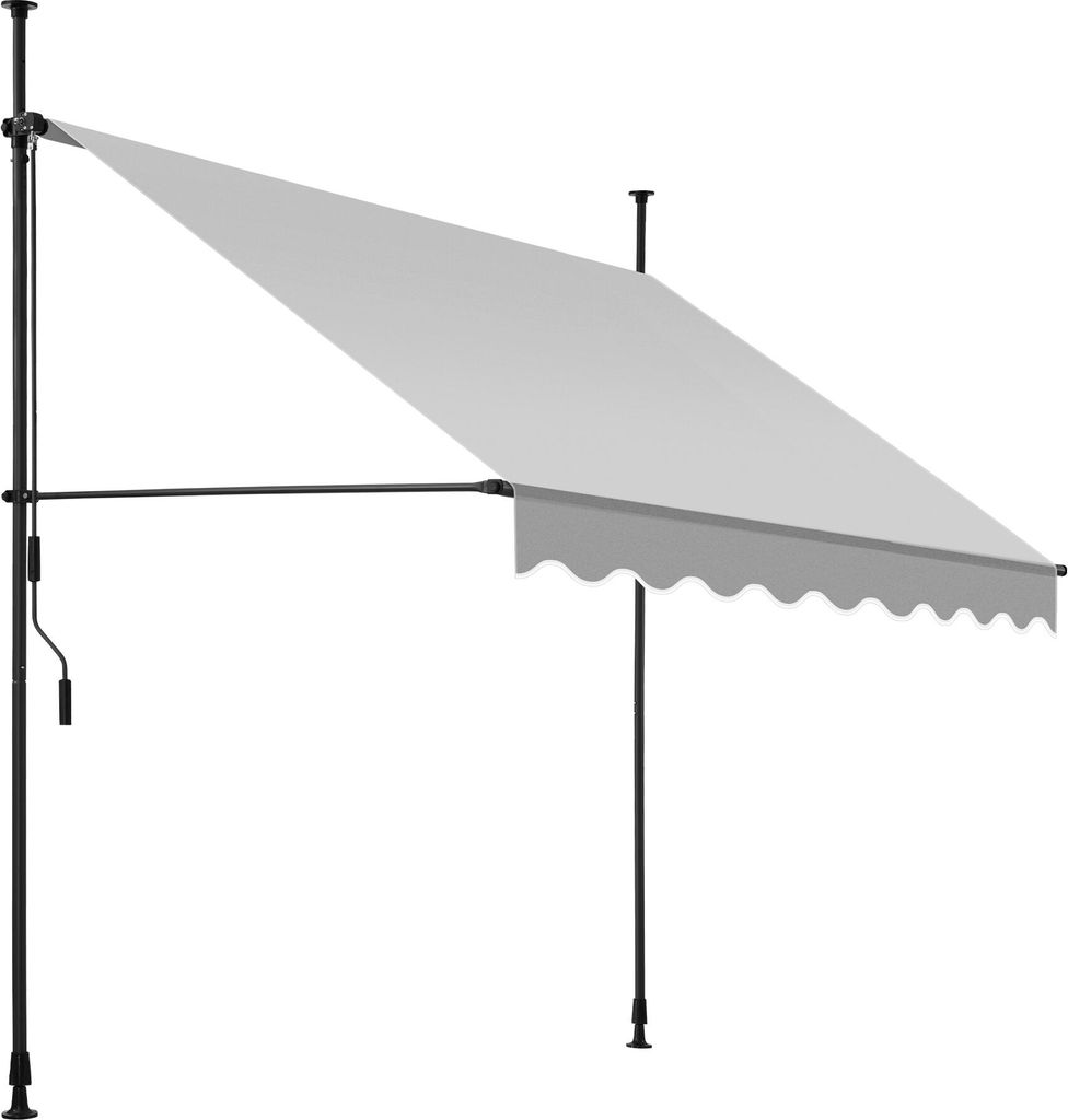 A light gray awning is extended from a black metal frame, supported by two vertical poles. The awning has a scalloped edge at the bottom. A crank handle is visible on the left pole.