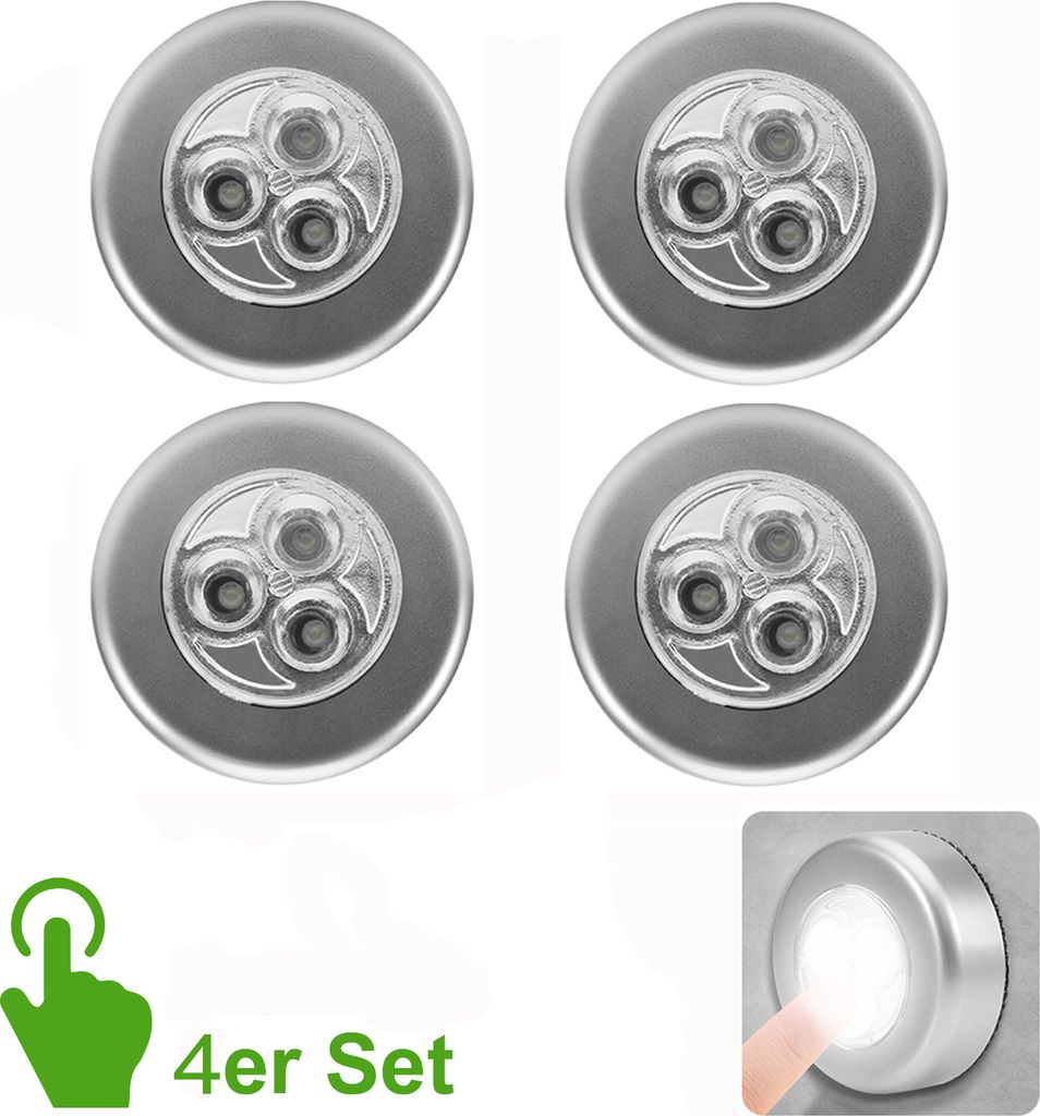 Four silver LED puck lights are arranged in a grid on a white background. A green icon of a hand touching a circle is in the bottom left corner, with the text '4er Set' below it. A small inset image in the bottom right shows a finger touching one of the li