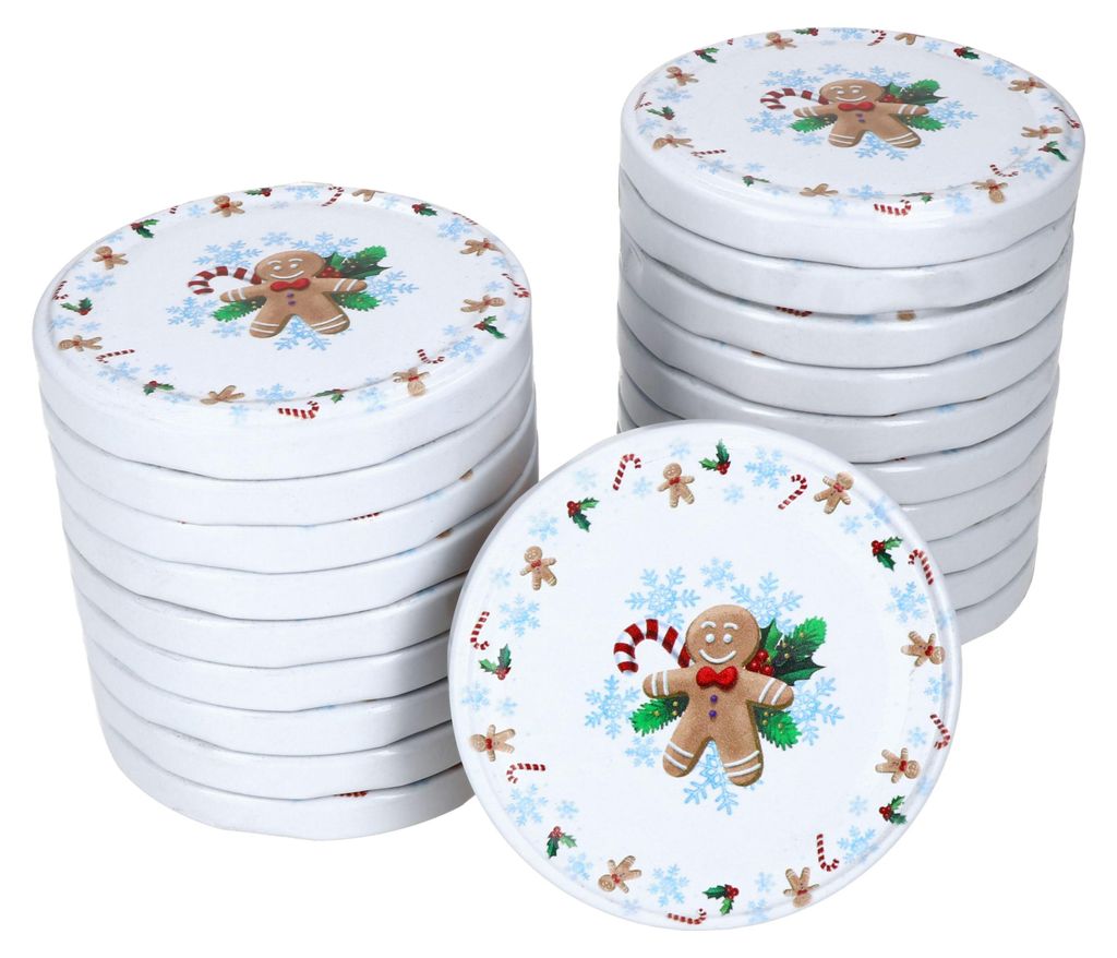 Stacks of round lids with a Christmas gingerbread man design.