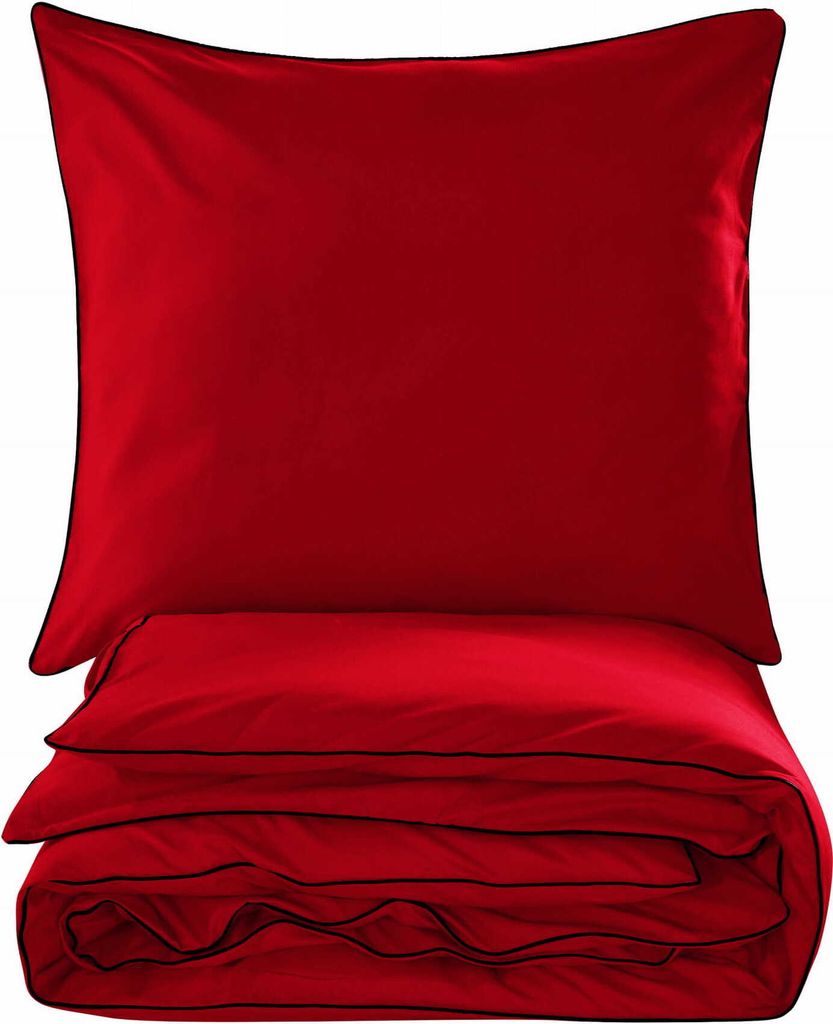 A folded red duvet and a red pillow with black trim, presented on a white background.