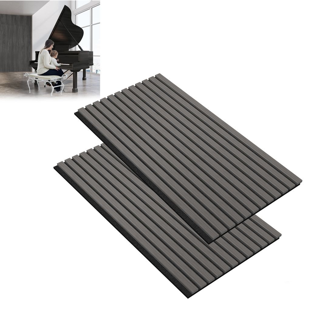 A person playing a piano in a room with acoustic panels on the wall.