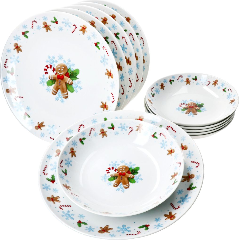A set of Christmas-themed dinnerware with gingerbread man and candy cane motifs.