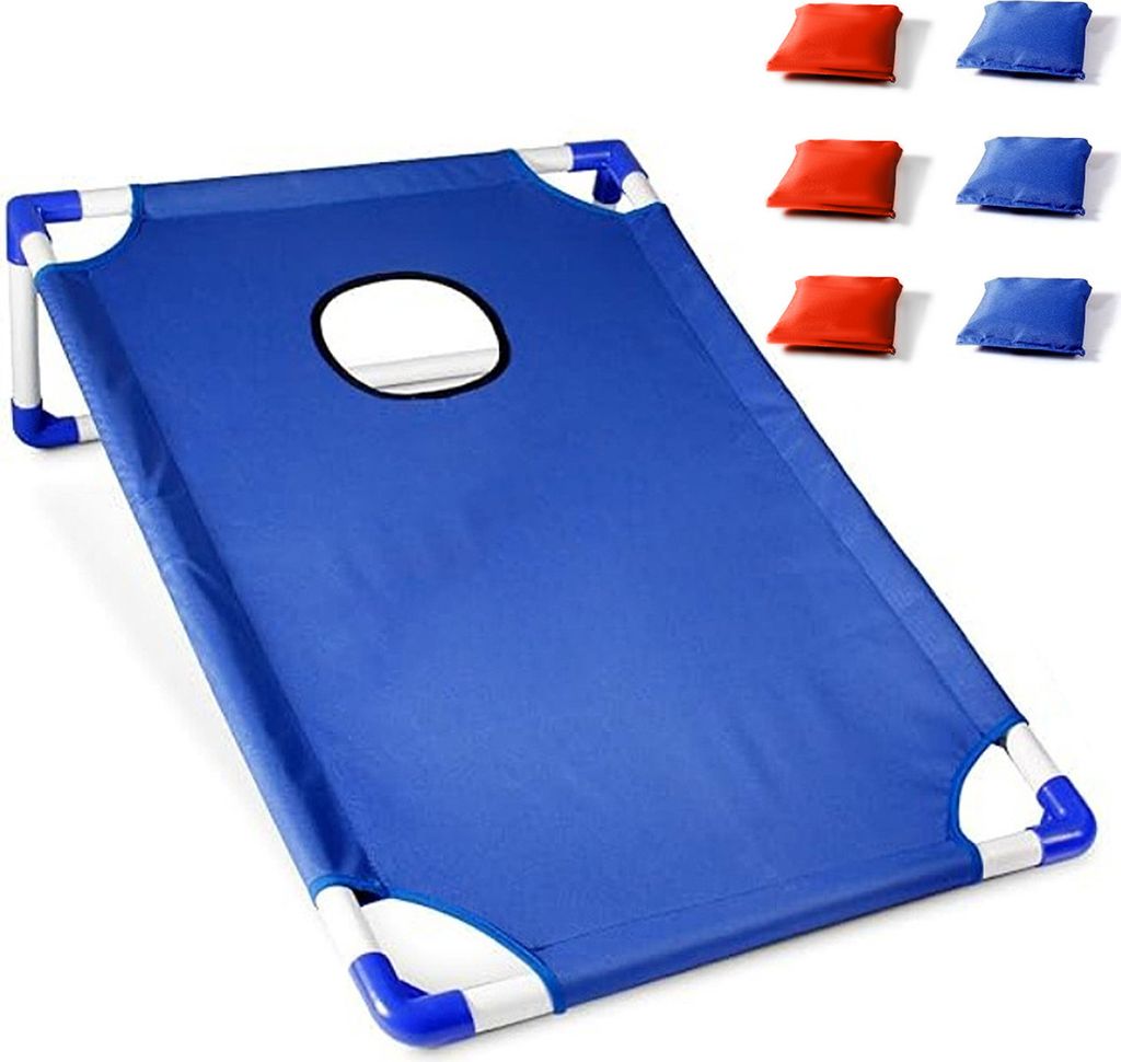 A blue cornhole game board with a hole in the center, and six bean bags (three red and three blue) are shown next to it.