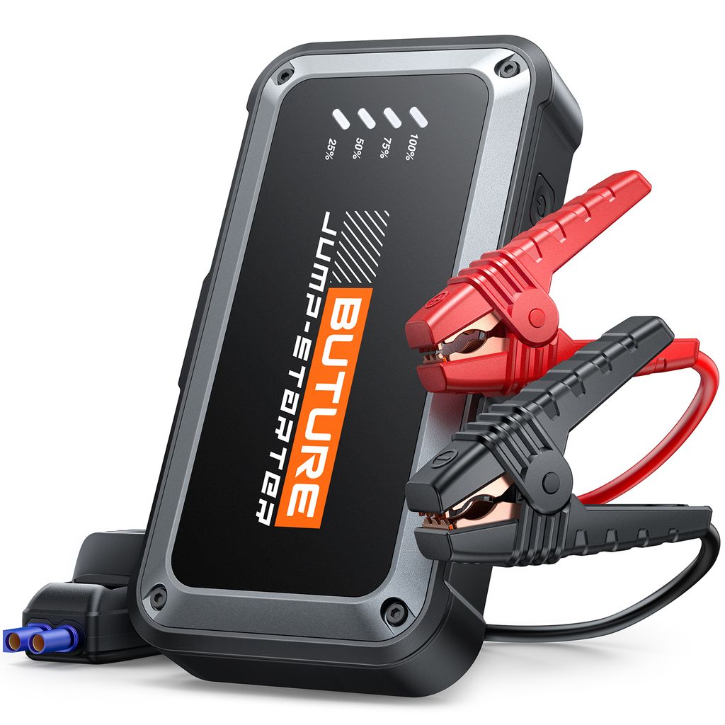 A black and gray jump starter power bank with red and black jumper cable clamps attached.