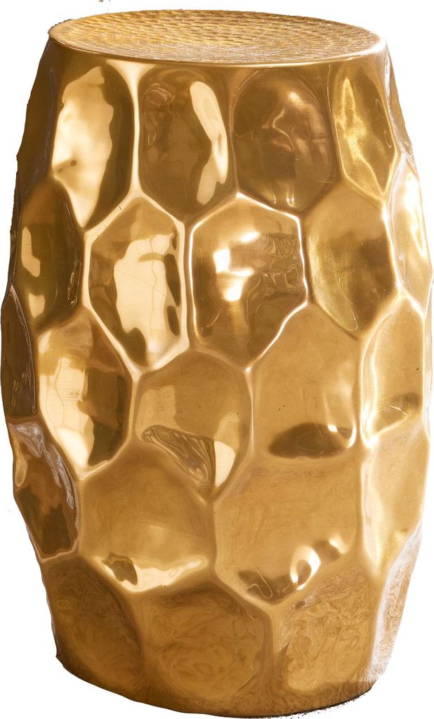 A gold-colored metallic stool with a hammered, honeycomb-like texture.