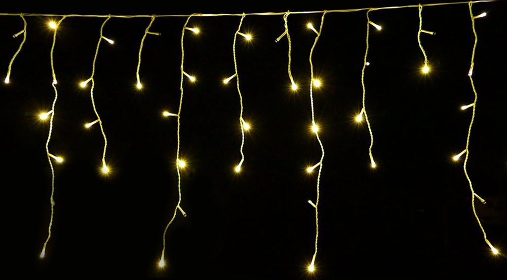 A string of icicle-shaped LED lights hanging against a black background.