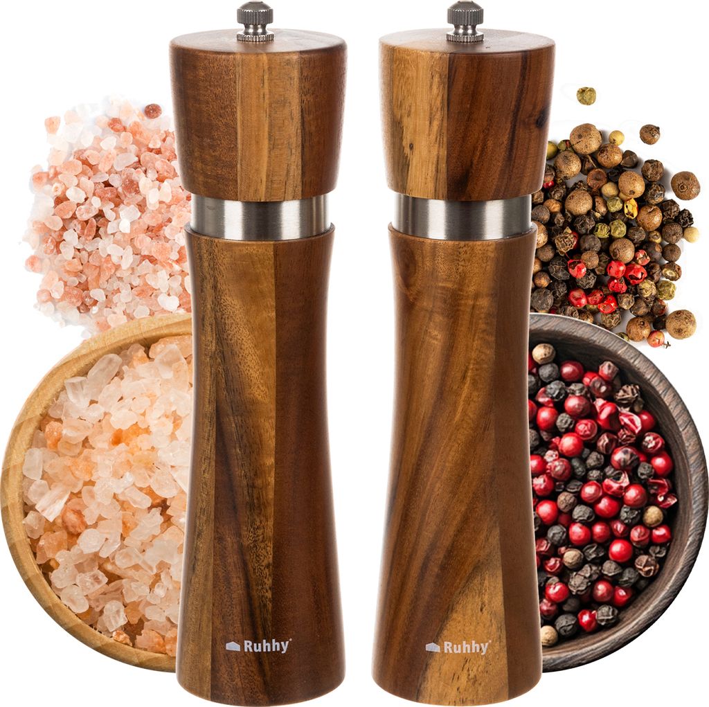 A set of wooden salt and pepper grinders with accompanying spices.