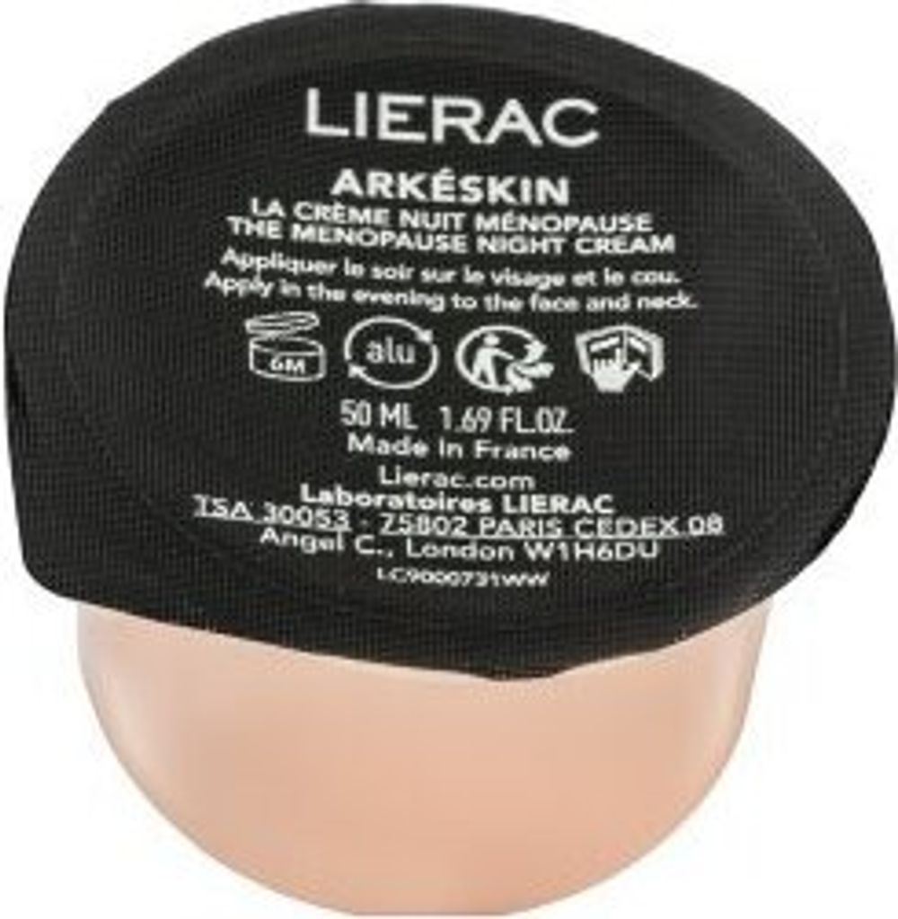 A close-up of the top of a Lierac Arkéskin cream jar, showing the lid with product information and branding.