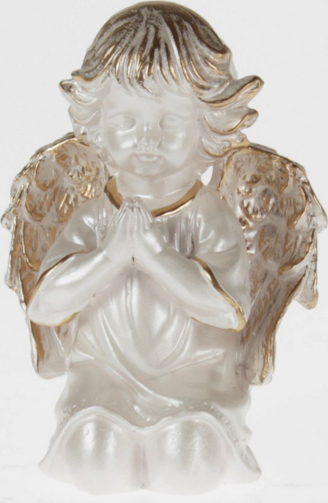 A white and gold angel figurine praying.