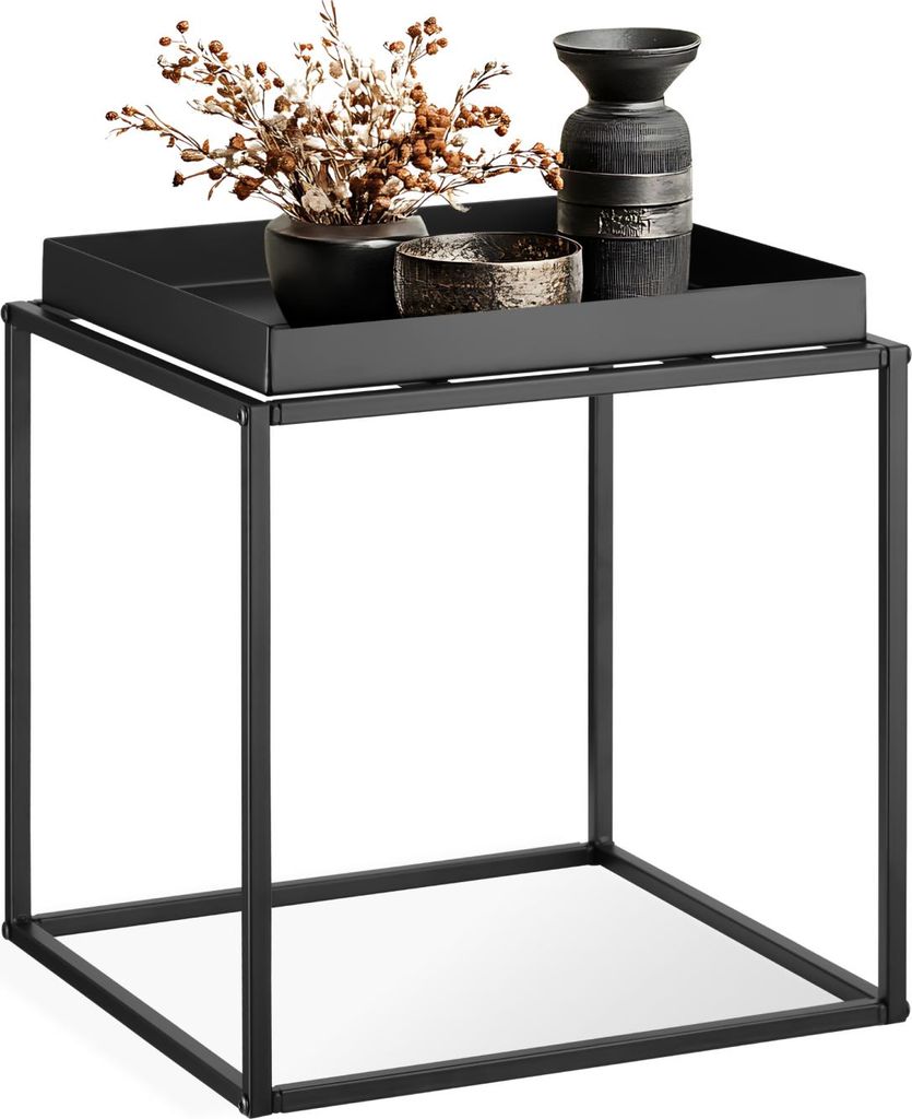 A black metal side table with decorative items on top.