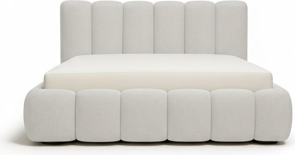 A white upholstered bed frame with a mattress on a white background.