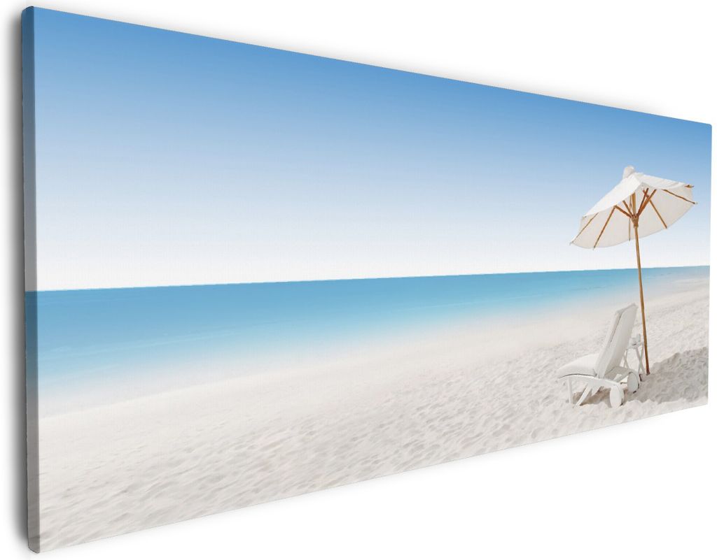 Wallario Premium Leinwandbild Sonnenliege am weißen Strand unter blauem Himmel in Größe 60 x 150 cm