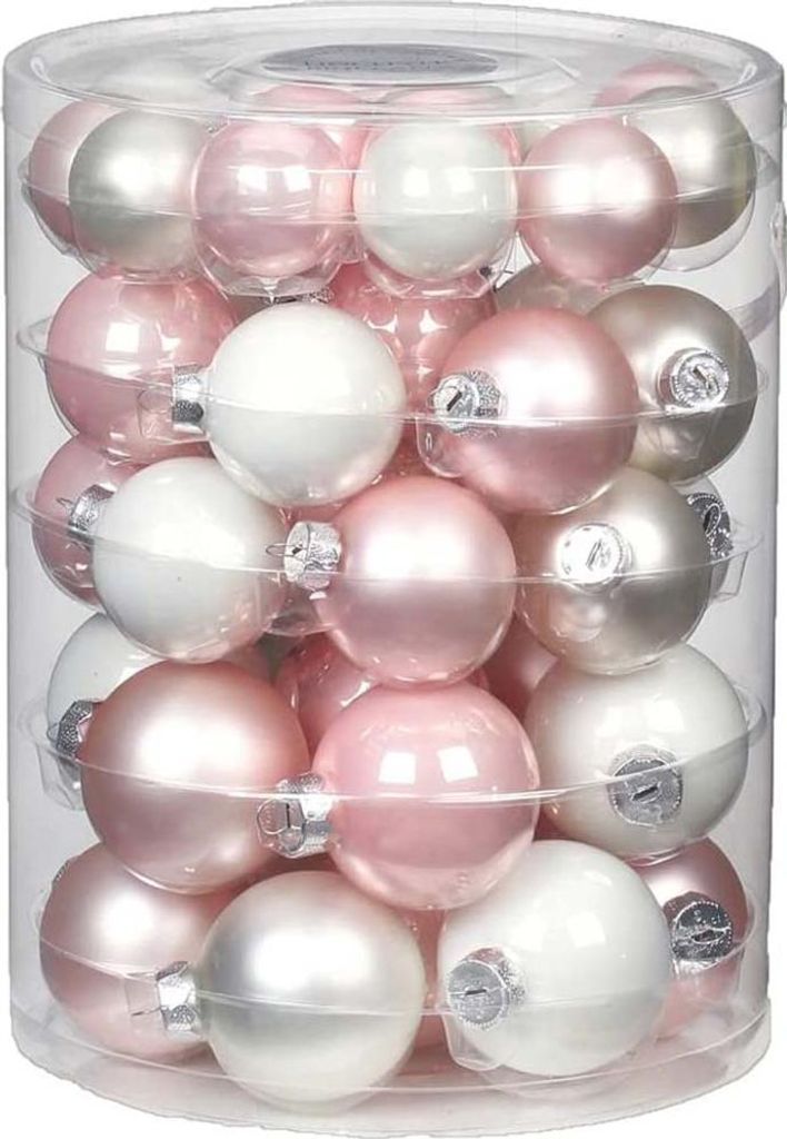 A clear, well-lit studio shot of a cylindrical container filled with Christmas ornaments.