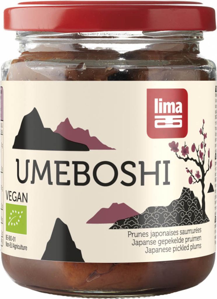 A jar of umeboshi plums on a white background.