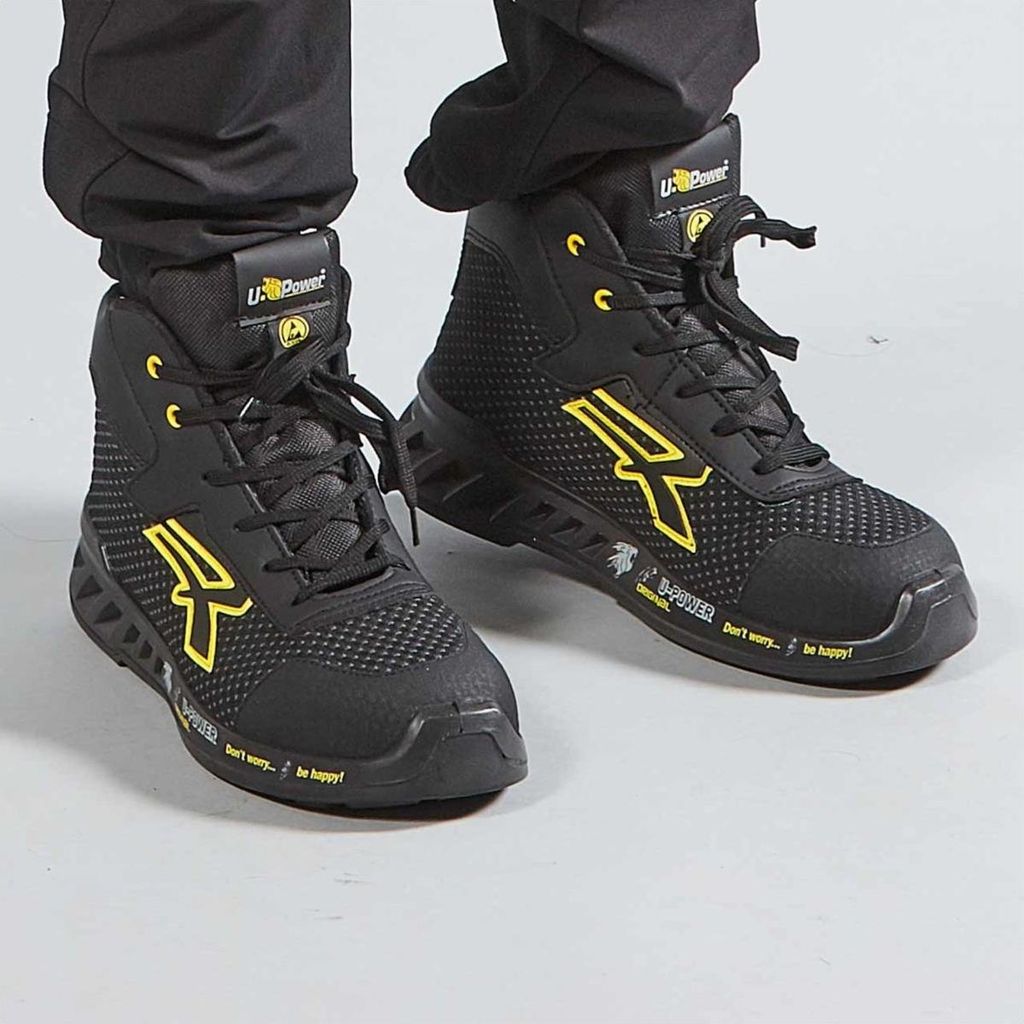 A pair of black and yellow U-Power safety high-top shoes.
