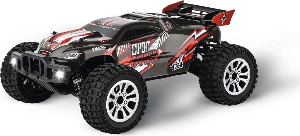 A remote-controlled buggy on a white background.