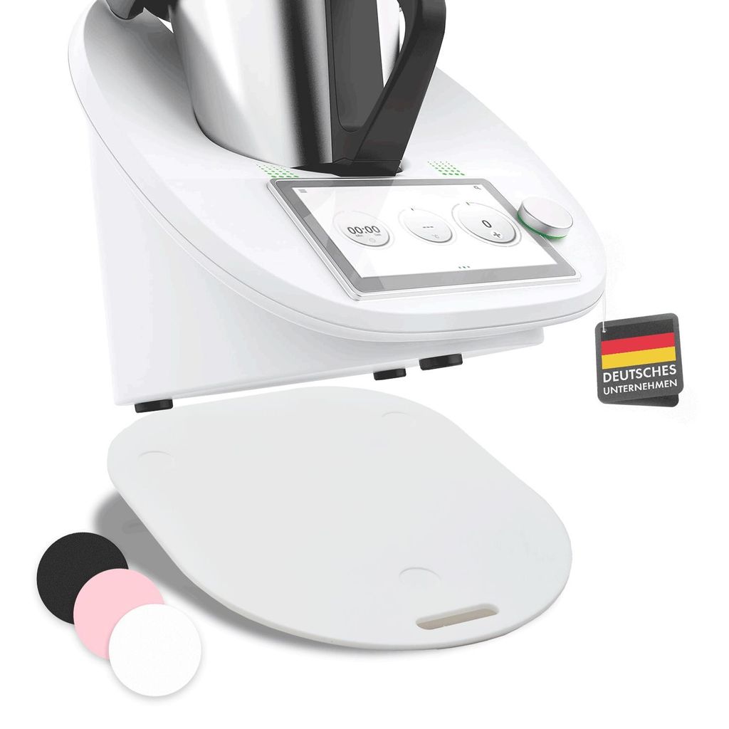 A white kitchen appliance with a touchscreen display and a white accessory underneath. Several colored circles are shown in the bottom left corner.