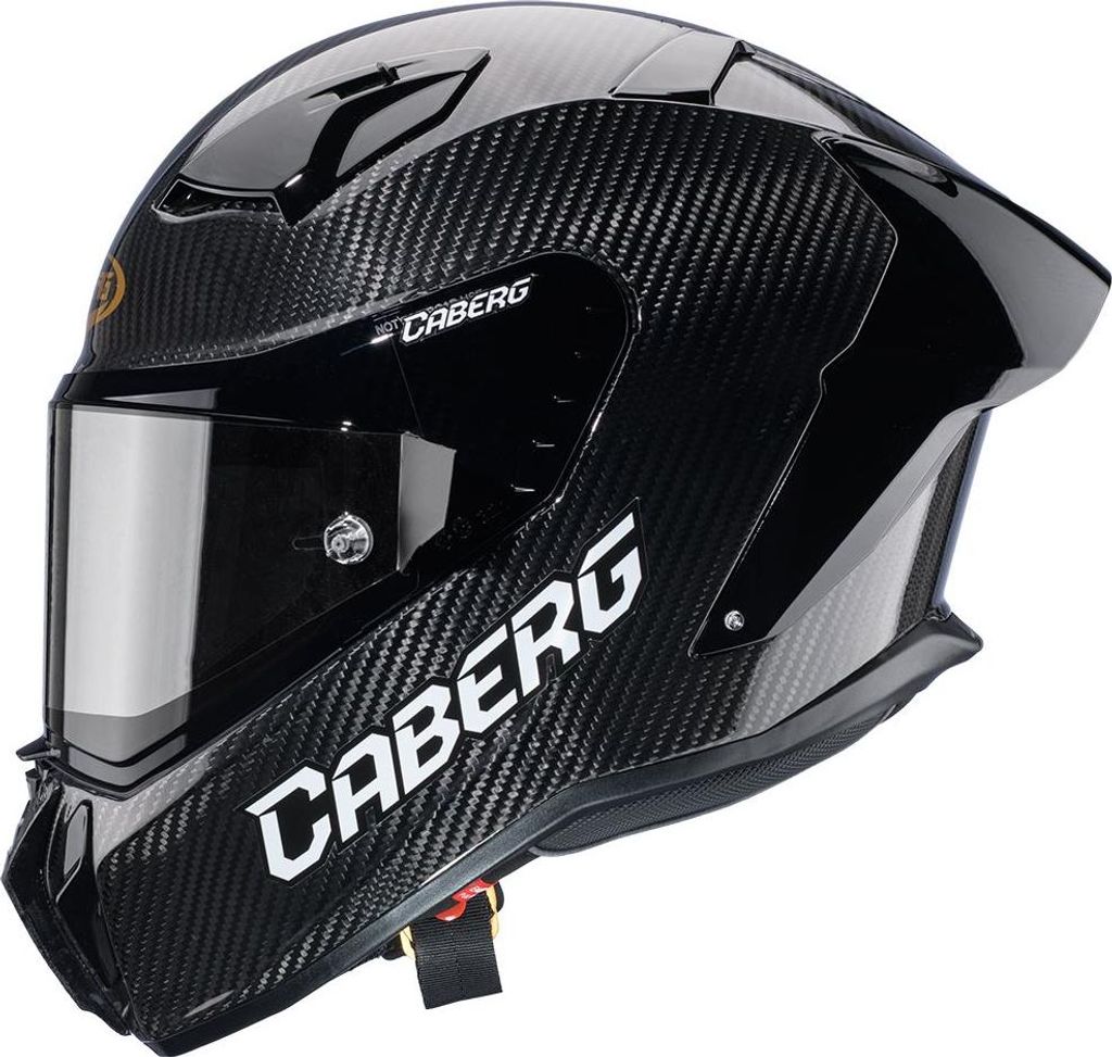 A black carbon fiber motorcycle helmet with a tinted visor.