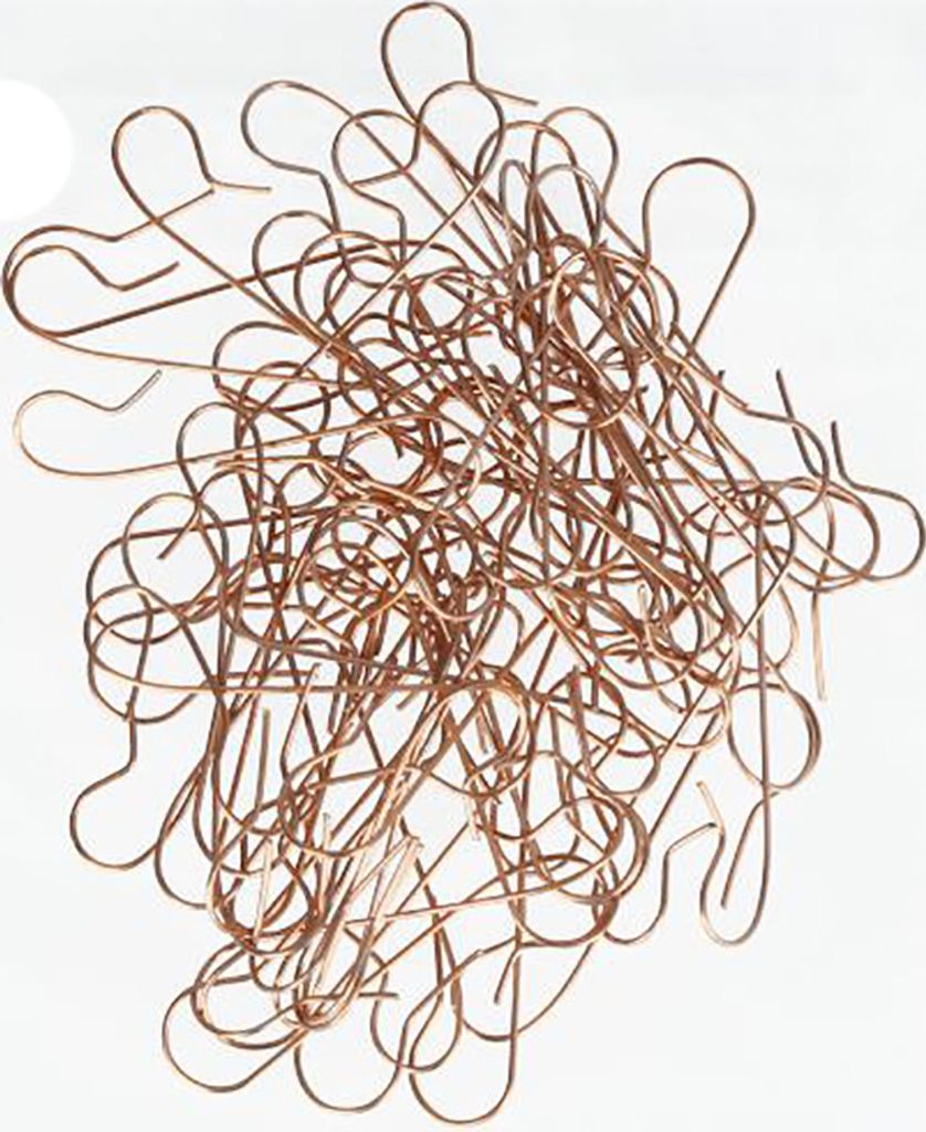 A pile of copper-colored Christmas ball hangers on a white background.