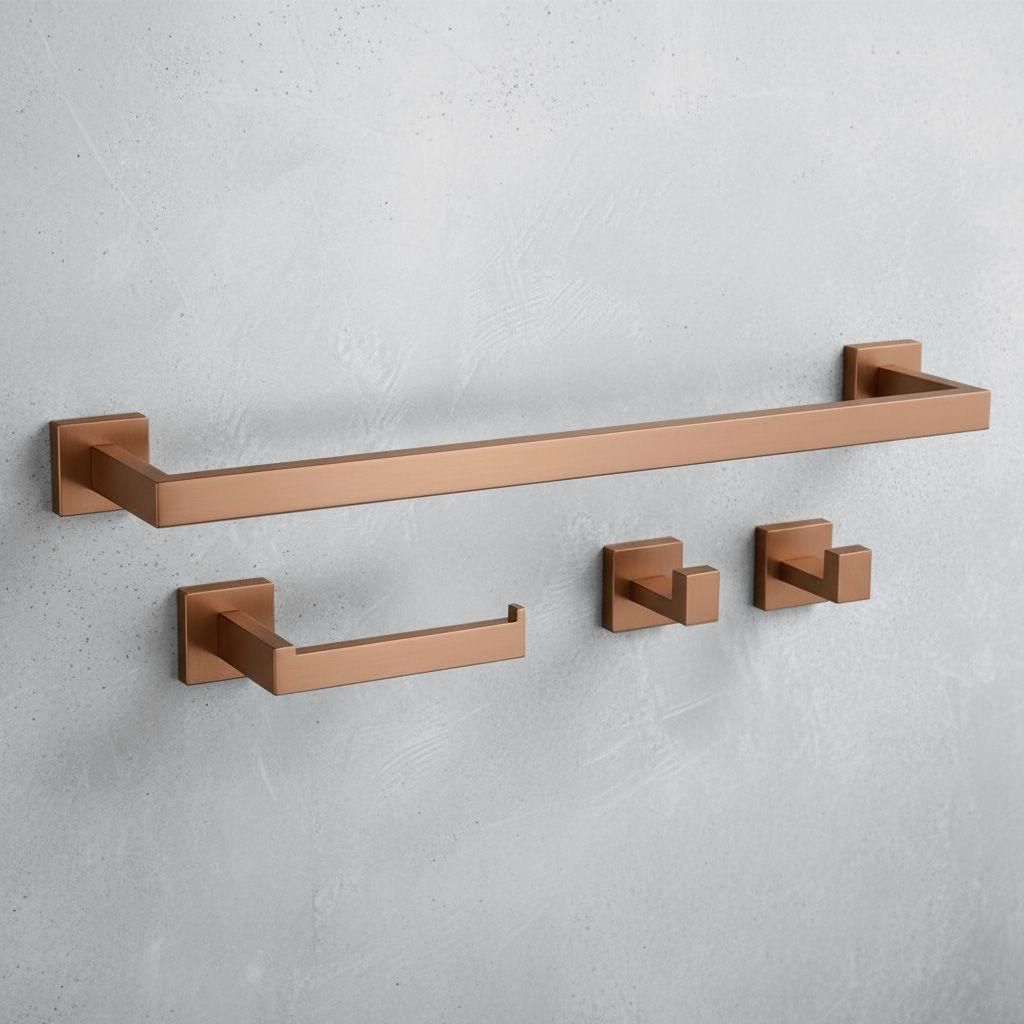 A set of copper-colored bathroom accessories mounted on a gray concrete wall.