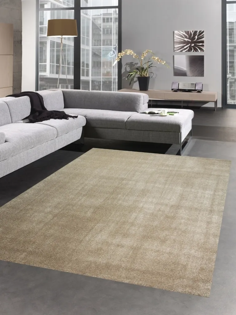 Tapis rond 120 cm taupe : la solution déco pour réchauffer vos sols froids