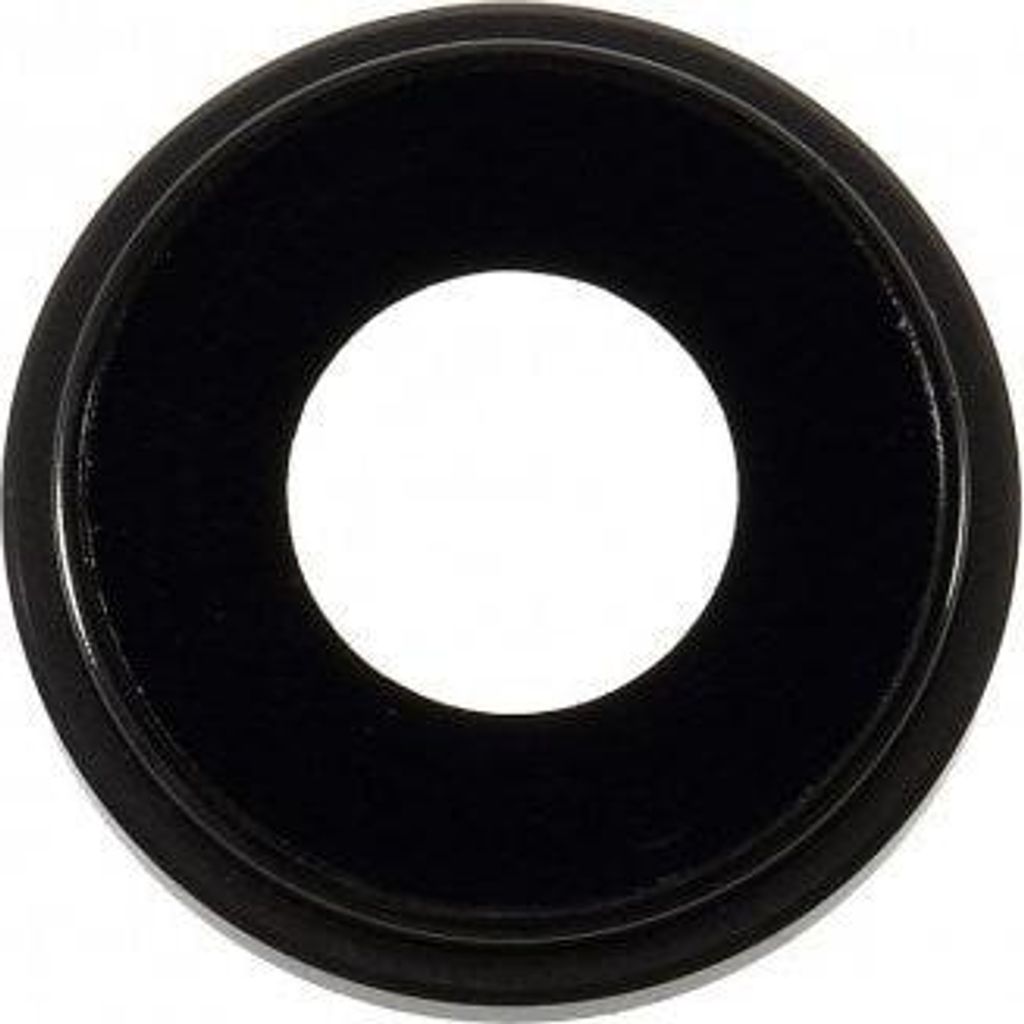 A black circular object with a white center is shown against a white background.