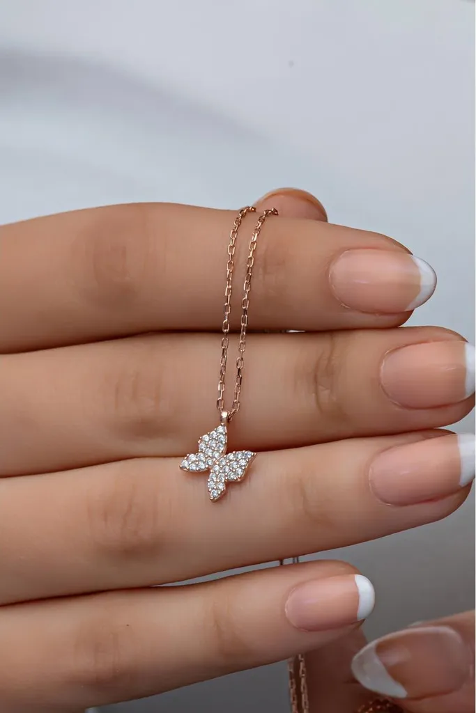Collier papillon argent rhodié et zircone, finition filigrane luxe